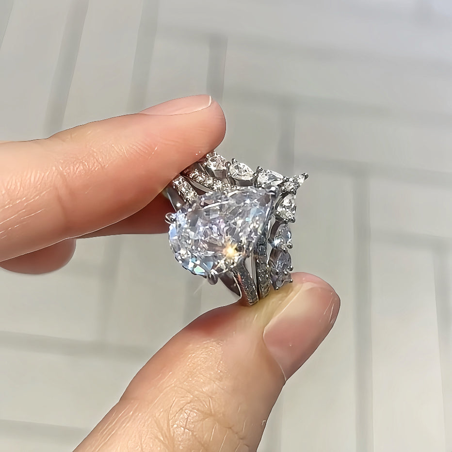 Enchanting Spark 3.0 Carat Pear Cut 2-Piece Wedding Set in Sterling Silver