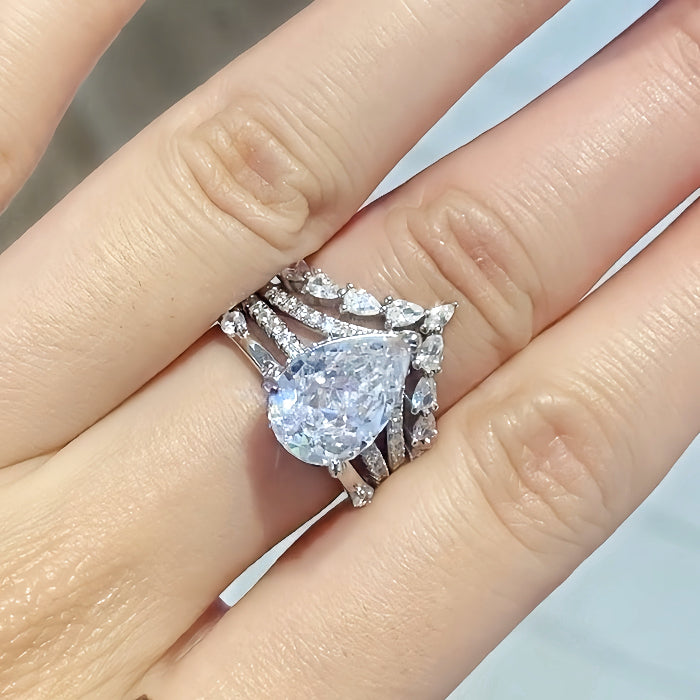 Enchanting Spark 3.0 Carat Pear Cut 2-Piece Wedding Set in Sterling Silver