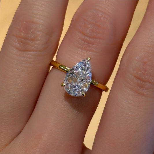 Golden Teardrop 2Ct Pear Cut Simulated Diamond Engagement Ring in Yellow Gold Plated Silver